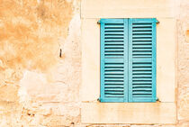 Detail view of wooden window shutters and wall of mediterranean house by Alex Winter