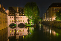 Night shot of famous Hospice of the Holy Spirit (Heilig Geist Spital) in the historic city center Nuremberg, Germany by Alex Winter