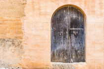 Vintage old wooden front door of a mediterranean house by Alex Winter