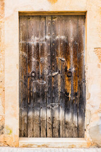 Vintage old grunge wooden front door of a mediterranean house by Alex Winter