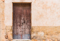 Vintage grunge house door and plaster wall of a mediterranean house by Alex Winter