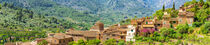Mallorca, panorama view of old village Fornalutx in mediterranean mountain landscape, Spain von Alex Winter