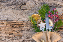 Christmas dinner menu table place setting on rustic wood background by Alex Winter