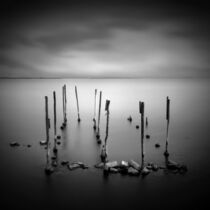 Sticks and stones in lagoon. by Kostas Pavlis