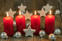 Christmas or Advent candles with xmas decoration by Alex Winter