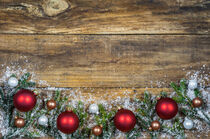Christmas border with xmas balls on wood background by Alex Winter