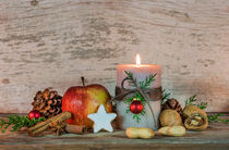 Burning xmas candle with christmas decoration by Alex Winter
