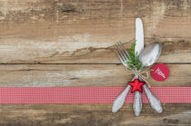 Table place setting for Christmas menu with silver cutlery by Alex Winter