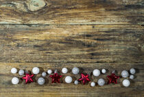 Christmas decorations on wood background by Alex Winter