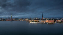 Skyline of Stockholm at night with Riddarholmskyrkan church and Stadshus on Gamla Stan old town island in Sweden by Bastian Linder
