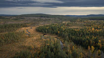 Wild landscape with forest and river in autumn in Jämtland in Sweden from above von Bastian Linder
