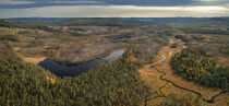 Wild landscape with forest, lake and river in autumn in Jämtland in Sweden from above by Bastian Linder