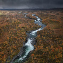 River with colourful trees in the countryside of Lapland in autumn in Sweden by Bastian Linder