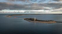 Coast and lighthouse Lange Erik in the north of the island of Öland in the east of Sweden from above during sunset by Bastian Linder