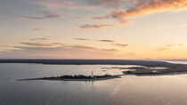 Coast and lighthouse Lange Erik in the north of the island of Öland in the east of Sweden from above during sunset by Bastian Linder