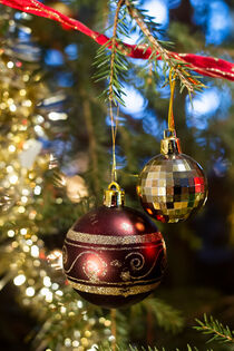 Red And Golden Baubles In The Christmas Tree by Jukka Heinovirta