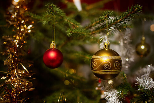 Two-christmas-baubles-hanging-on-the-christmas-tree