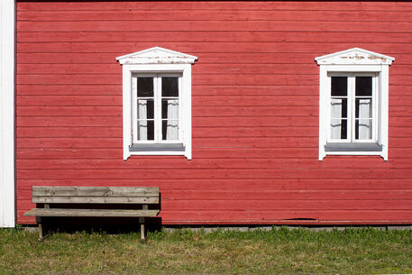 Two-windows-and-a-wooden-bench