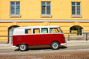 Camper-van-parked-by-a-yellow-building