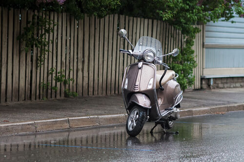 Scooter-parked-in-the-rain