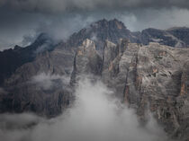 Mountain cliffs at Three Peaks and Paternkofel in the Dolomite Alps in South Tyrol with clouds by Bastian Linder