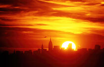 New York sunset skyline with jet by David Halperin