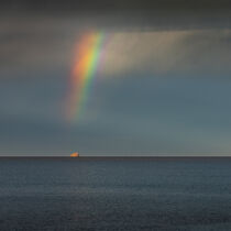 Rainbow over island Isola di Molarotto after rain during sunset in Sadinia Italy at San Teodoro by Bastian Linder