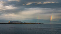 Rainbow over coastline and island at San Teodoro after rain during sunset in Sadinia Italy by Bastian Linder