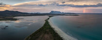 San Teodoro sand beach with lagoon, mountain of island Tavolara and coastline in Sadinia Italy from above during sunset, clouds and rainbow in sky by Bastian Linder