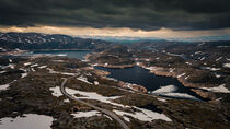 Landscape with lonesome road around Lysefjord in Rogaland with lakes and snow in Norway by Bastian Linder