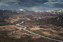 River Leirungsae with snow covered mountains in Jotunheimen National Park in Norway from above by Bastian Linder