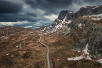 Landscape with road and mountain ridge in Jotunheimen National Park in Norway from above by Bastian Linder