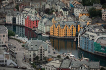 Overlooking the colorful houses of city Alesund in Norway by Bastian Linder