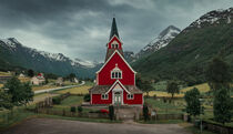 Red wooden church of Olden in the Nordfjord fjord in summer in Norway by Bastian Linder