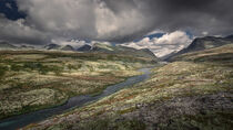 Rondane national park in Norway with winding river and mountains by Bastian Linder