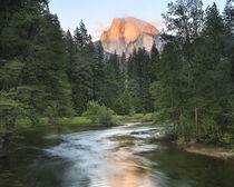 Half Dome with Sunset over Merced River. Yosemite, California. Tom Norring / Danita Delimont