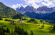 St Maddalena church and village in the Italian valley of Val Di Funes, Dolomites mountains in the background. Bill Bachmann / Danita Delimont. by Danita Delimont
