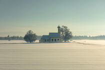 Bavarian church of Raisting with snow and mist during winter by Bastian Linder