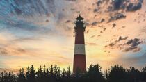 Leuchtturm im Sonnenuntergang by Dieter Stahl
