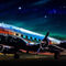 Thonksy-a-dc3-airplane-parked-on-the-runway-at-night-with-its-l-934e5e13-3356-4a1d-9ff8-228432851df5