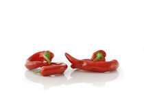 Four Red Peppers by Tomer Burmad
