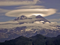 Mount Rainier (volcano) with a glowing lenticular cloud by Ed Book