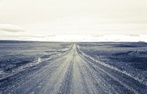 Unpaved gravel road by Vincent Demers