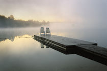 Canada, Ontario, Algonquin Provincial Park, Chairs on dock.   Credit as von Danita Delimont
