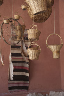 Wicker baskets and dreamcatchers hanging in a restaurant by Panoramic Images