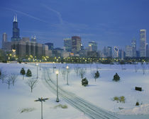 High angle view of snow covered landscape with buildings in the background by Panoramic Images