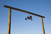 Toy tractor hanging on an entrance by Panoramic Images