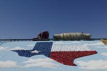 Low angle view of truck and map of Texas on the slope beside a highway by Panoramic Images