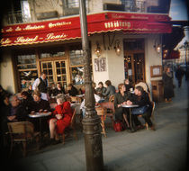 Tourists sitting at a sidewalk cafe, Bistrot Ile St Louis, Paris, France by Panoramic Images