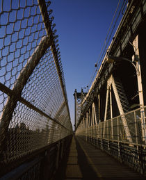 Walkway on a bridge by Panoramic Images